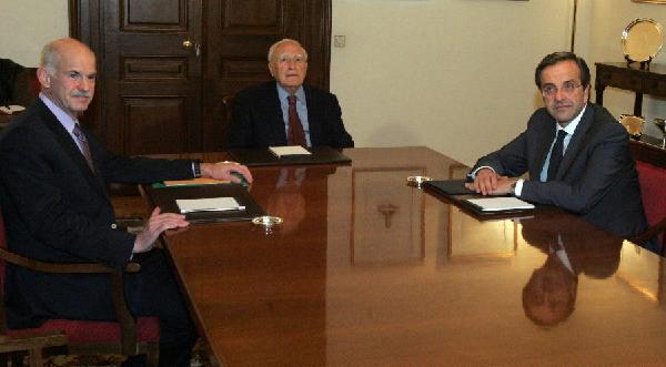 Greek President Karolos Papoulias (C) holds a meeting with Prime Minister George Papandreou (L) and the main Greek opposition leader Antonis Samaras at the Presidential Mansion in Athens, Greece, Nov. 6, 2011. In response to a call by Papandreou, Antonis Samaras accepted a meeting later on Sunday evening hosted by Papoulias to discuss a new coalition government. [Marios Lolos/Xinhua] 